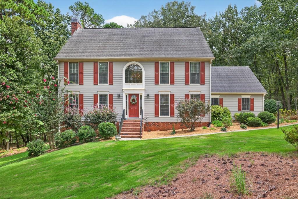 82 Cedar Bluff Winder, GA 30680 - Photo 3 of 47 a front view of a house with a yard