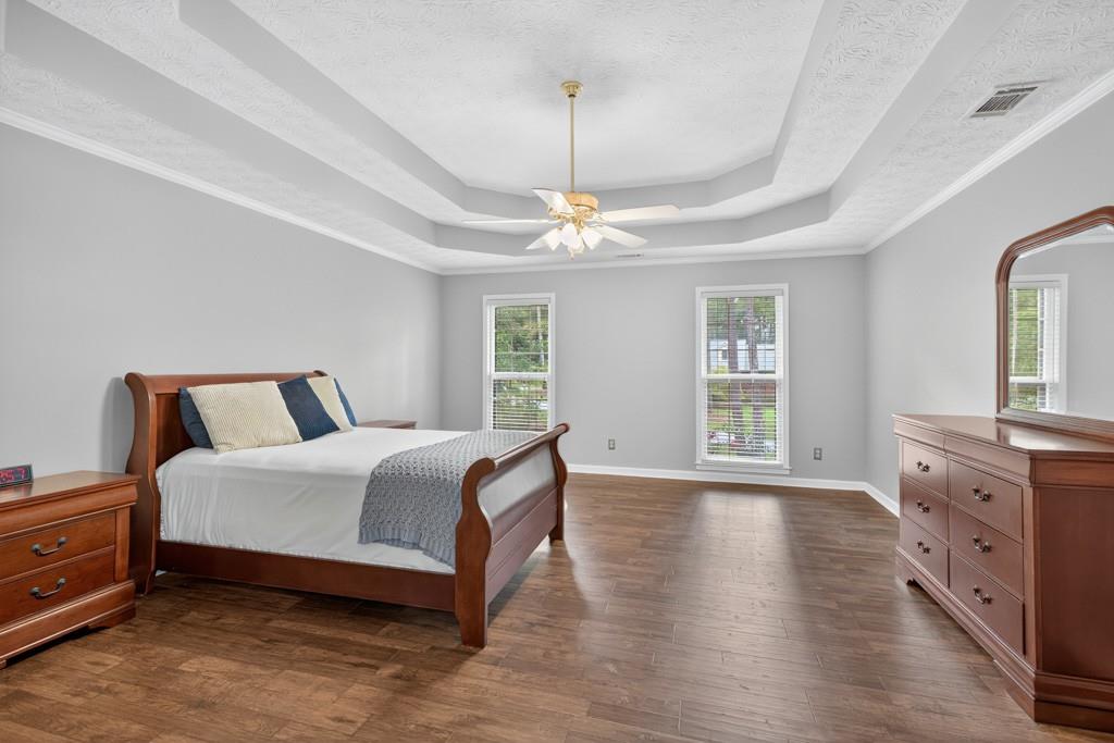 82 Cedar Bluff Winder, GA 30680 - Photo 33 of 47 a spacious bedroom with a bed and a dresser