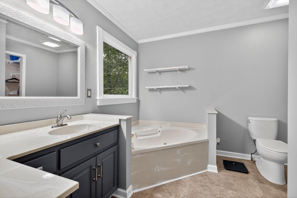 82 Cedar Bluff Winder, GA 30680 - Photo 34 of 47 a bathroom with a sink a toilet and tub