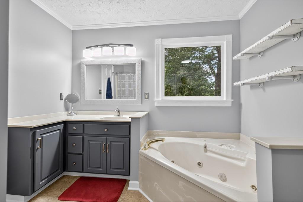 82 Cedar Bluff Winder, GA 30680 - Photo 35 of 47 a bathroom with a tub sink and window