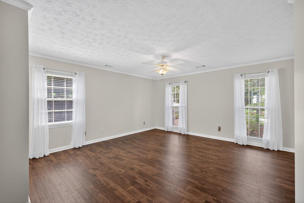82 Cedar Bluff Winder, GA 30680 - Photo 36 of 47 an empty room with wooden floor and windows