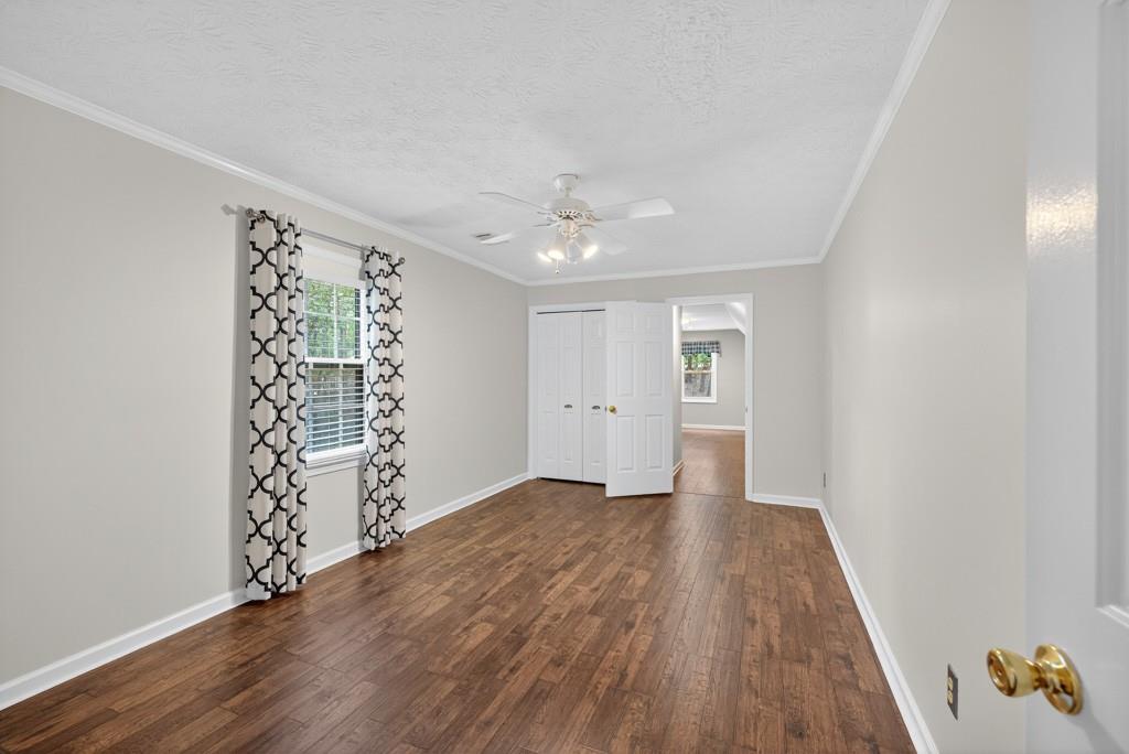 82 Cedar Bluff Winder, GA 30680 - Photo 37 of 47 wooden floor in an empty room with a window