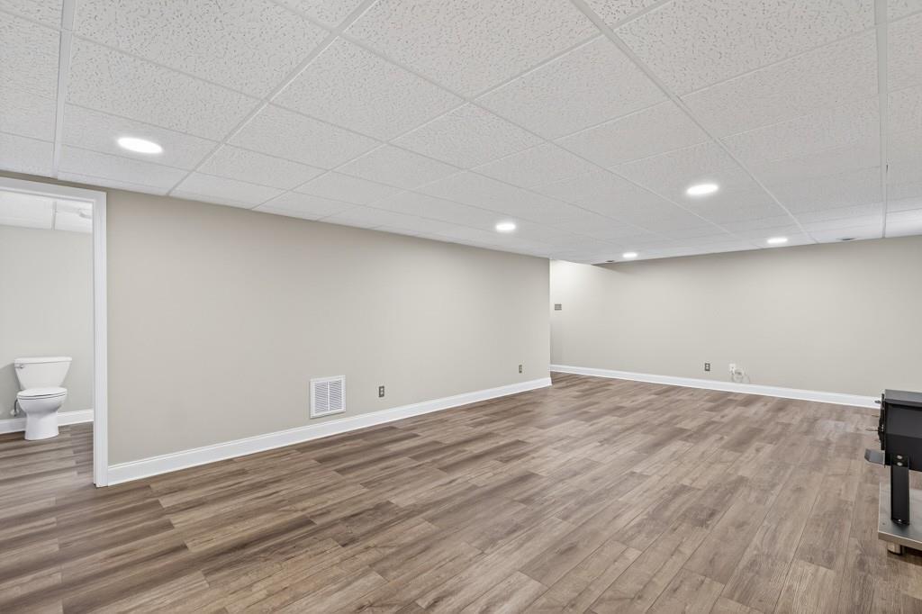 82 Cedar Bluff Winder, GA 30680 - Photo 44 of 47 an empty room with wooden floor and toilet