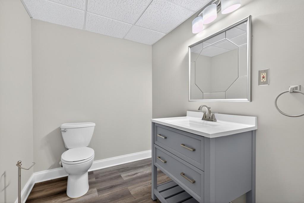 82 Cedar Bluff Winder, GA 30680 - Photo 45 of 47 a bathroom with a toilet a sink and mirror