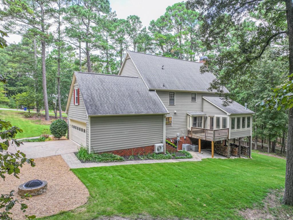 82 Cedar Bluff Winder, GA 30680 - Photo 9 of 47 a aerial view of a house with a yard deck and a patio