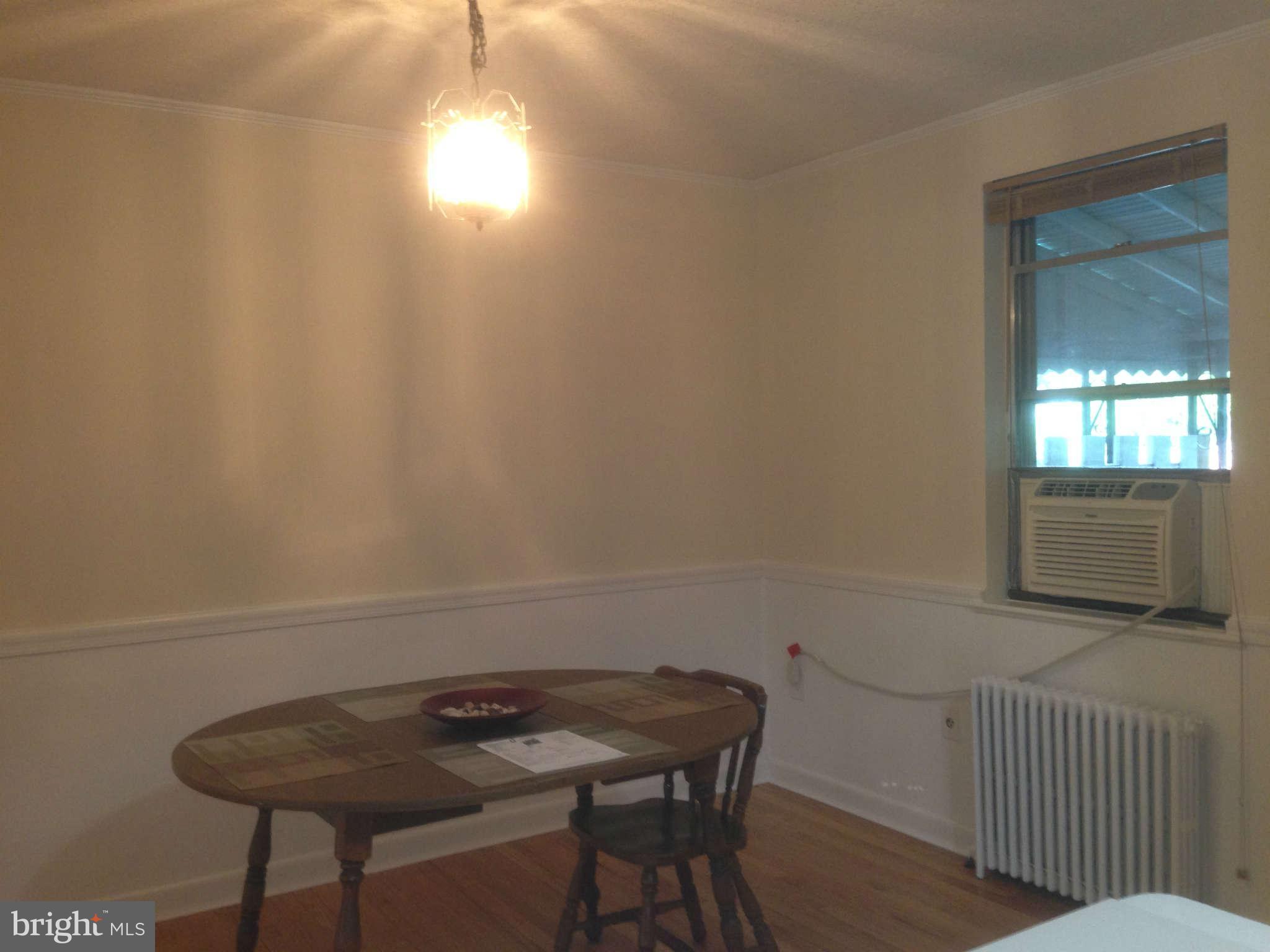 1728 Pin Oak Road Baltimore, MD 21234 - Photo 5 of 19 a view of a workspace with furniture and a window