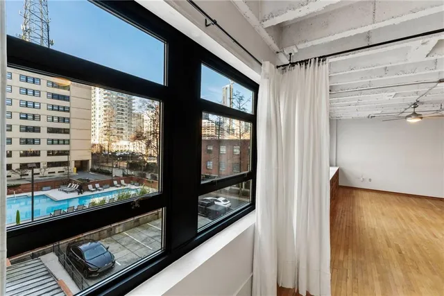 a view of a balcony with wooden floor
