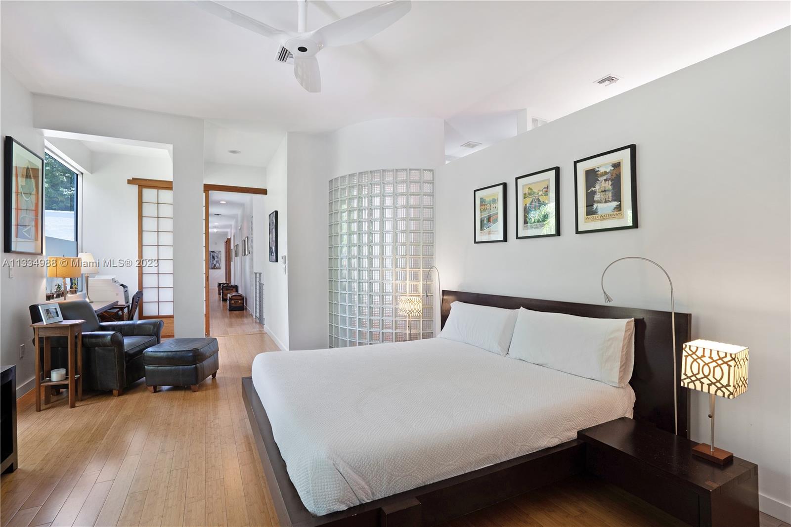 4091 Park Avenue Miami, FL 33133 - Photo 14 of 35 a bedroom with a bed and wooden floor