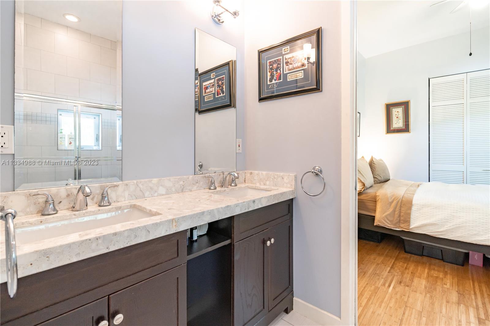 4091 Park Avenue Miami, FL 33133 - Photo 19 of 35 a en suite bathroom with a sink and a mirror