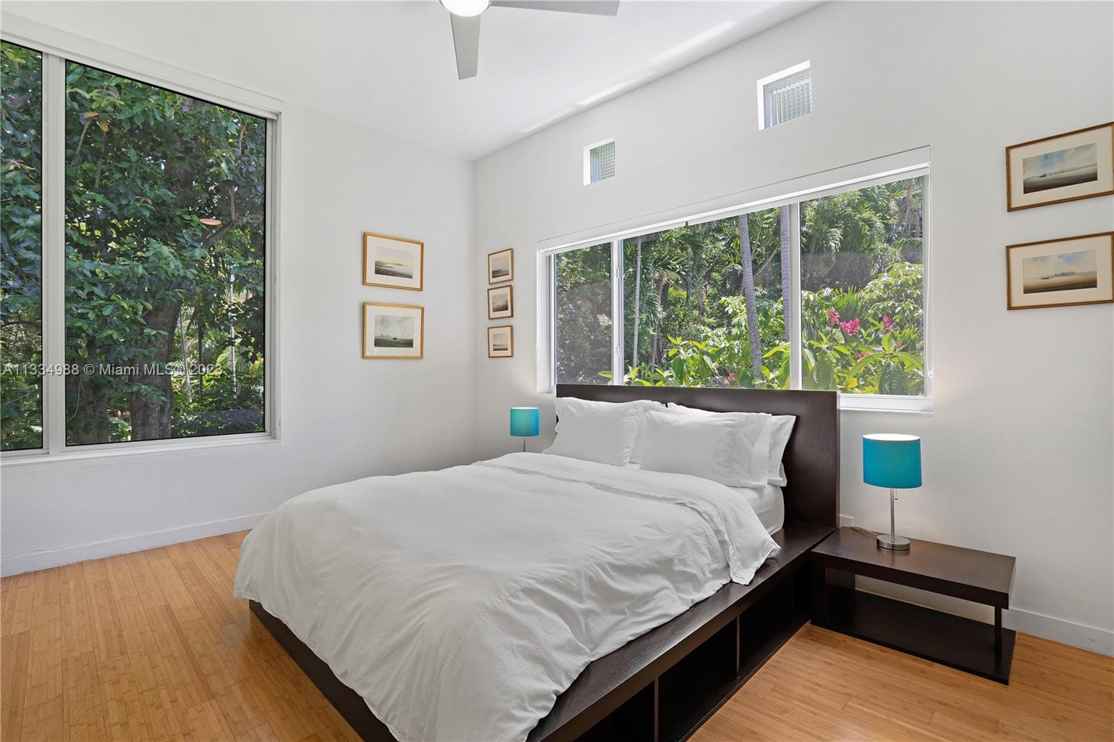 4091 Park Avenue Miami, FL 33133 - Photo 20 of 35 a large bed sitting in a bedroom next to a window