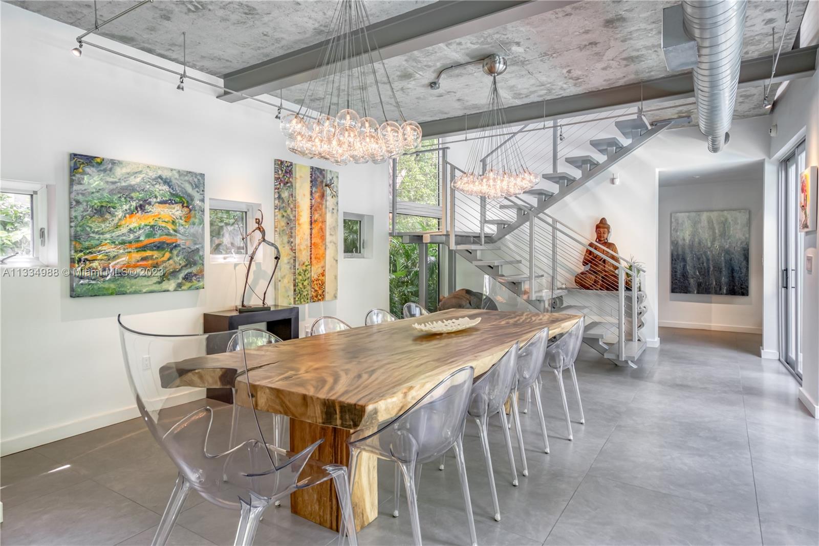 4091 Park Avenue Miami, FL 33133 - Photo 2 of 35 a view of a dining room with furniture and wooden floor
