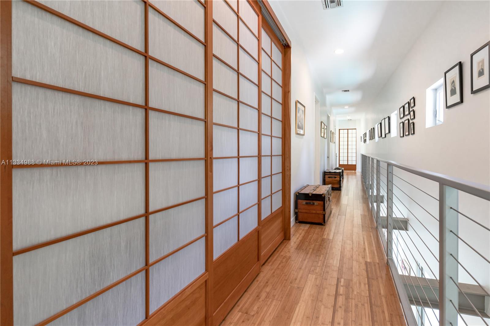 4091 Park Avenue Miami, FL 33133 - Photo 21 of 35 a bathroom with a sink and a large mirror