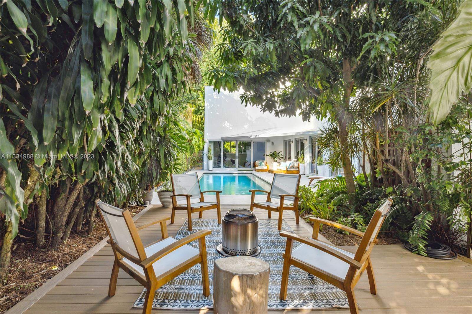 4091 Park Avenue Miami, FL 33133 - Photo 26 of 35 a view of a chairs and table in a patio