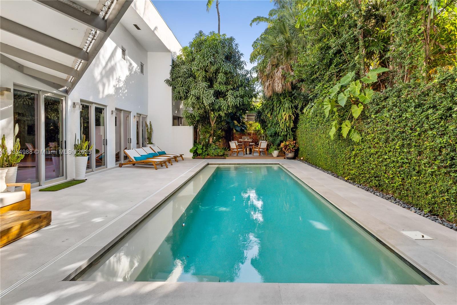 4091 Park Avenue Miami, FL 33133 - Photo 8 of 35 a view of a swimming pool with a patio