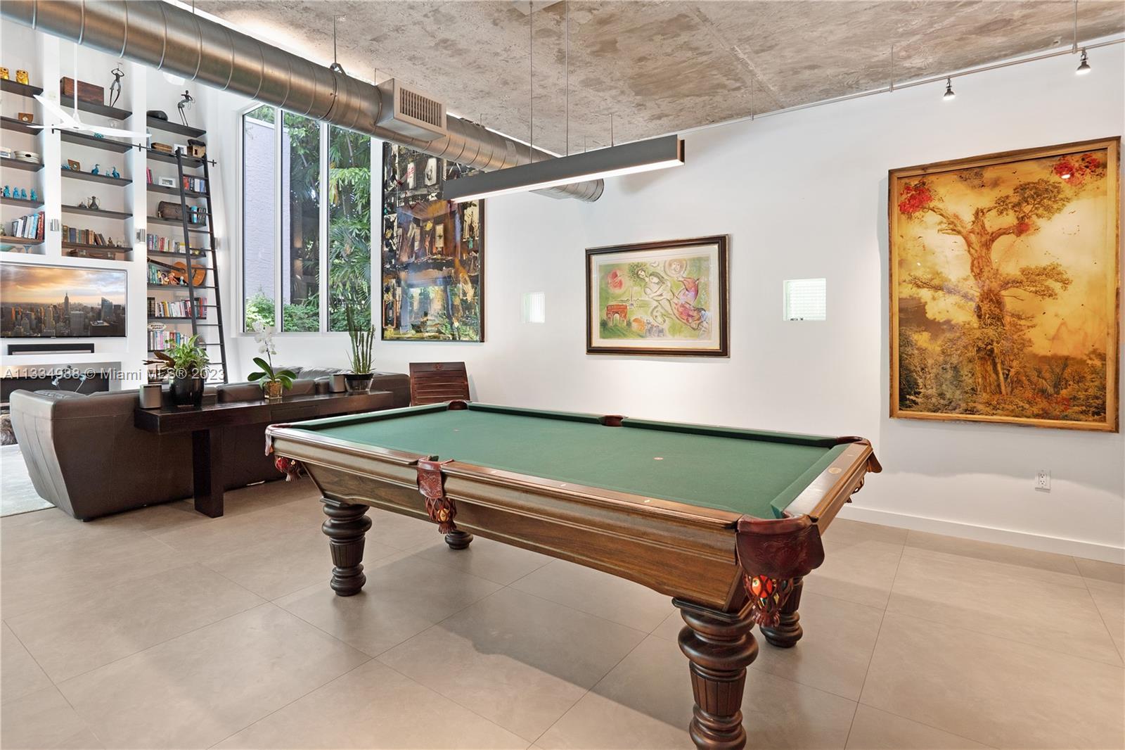 4091 Park Avenue Miami, FL 33133 - Photo 9 of 35 a room with pool table and windows