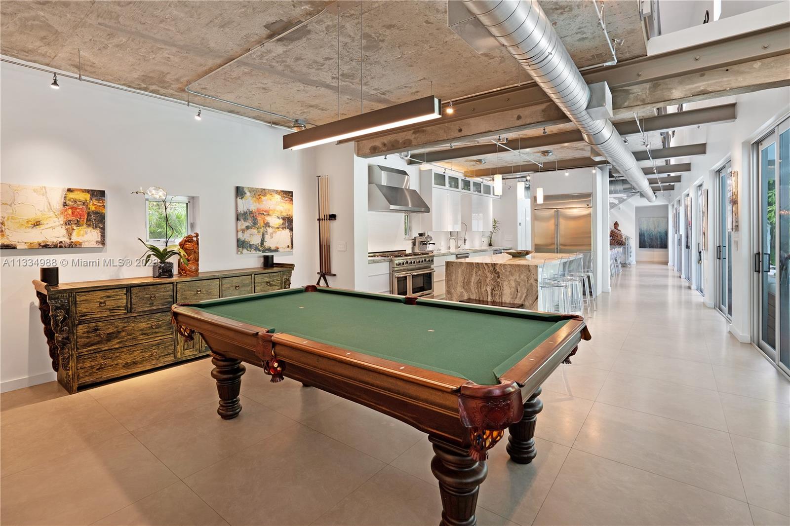 4091 Park Avenue Miami, FL 33133 - Photo 10 of 35 a room with pool table and windows