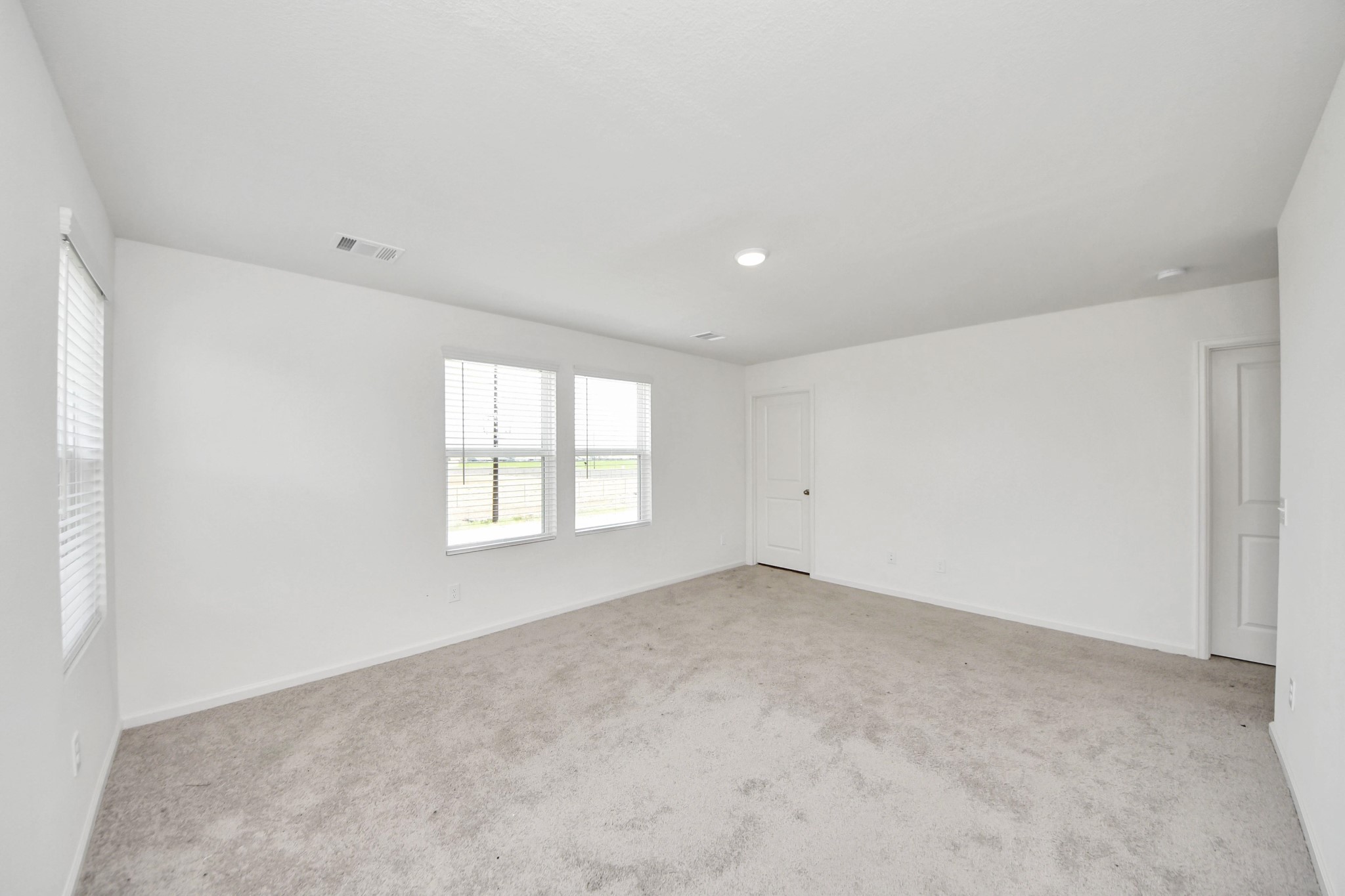 10303 Rose Mar Drive, Unit B Rosharon, TX 77583 - Photo 19 of 49 an empty room with a window
