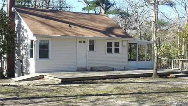 560 Paradise Shores Road Southold, NY 11971 - Photo 1 of 1 Front from NE corner of yard