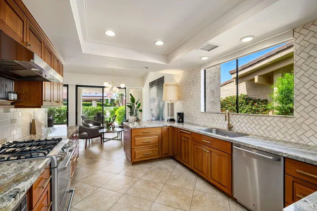 a view of a patio with table and chairs