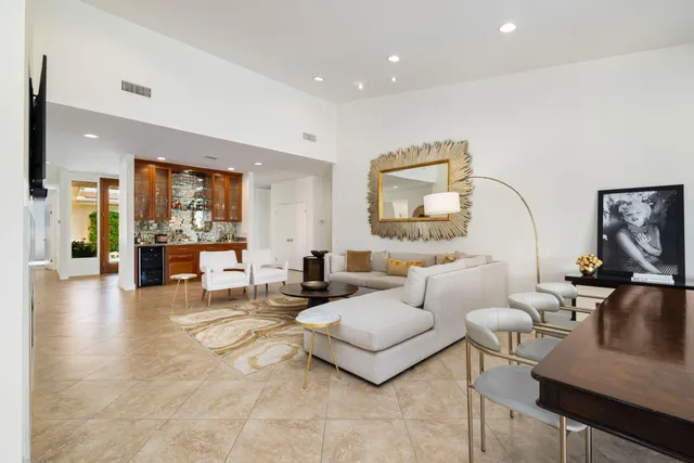 a bedroom with a large bed and a large window