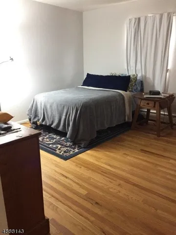 a bedroom with a bed and a table in it