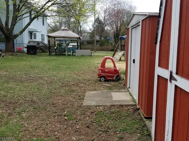 a view of a house with a back yard