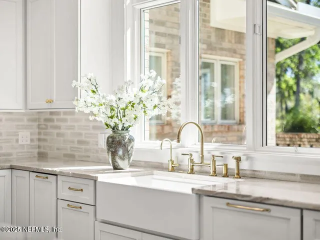 a view of a swimming pool with an outdoor space and seating area