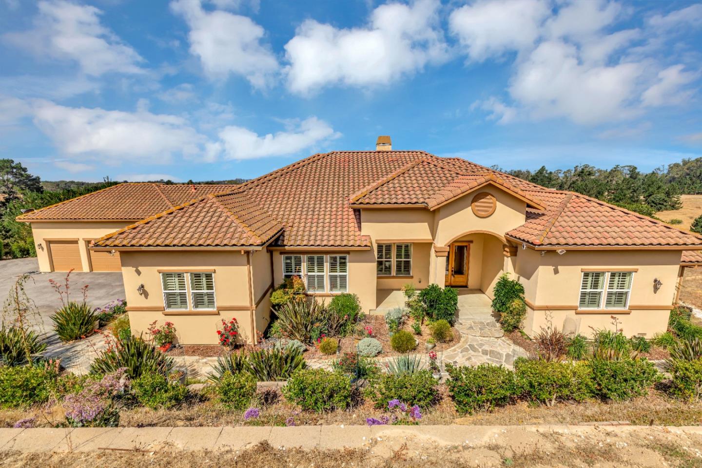 front view of a house with a yard