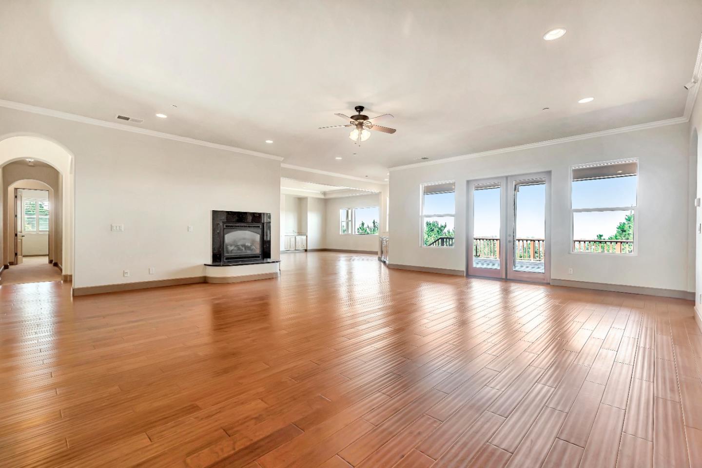 8944 Hidden Canyon Road Salinas, CA 93907 - Photo 11 of 22 an empty room with wooden floor and windows