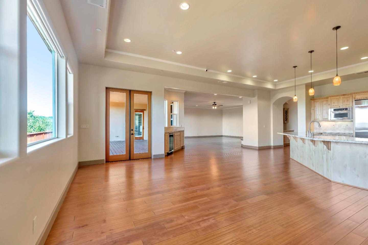 8944 Hidden Canyon Road Salinas, CA 93907 - Photo 13 of 22 a view of empty room with wooden floor and windows