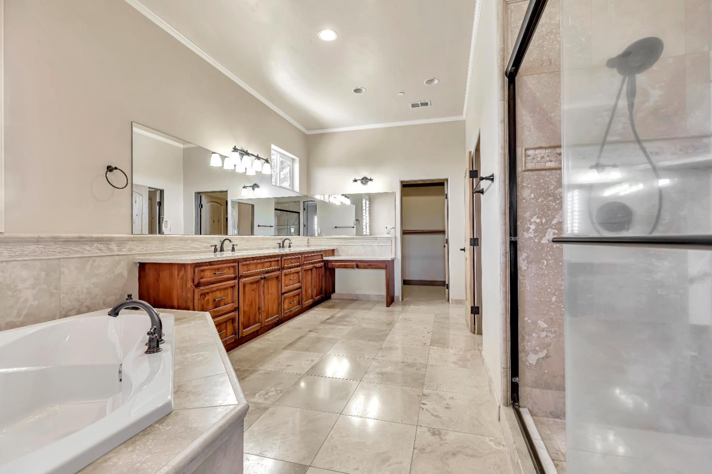 8944 Hidden Canyon Road Salinas, CA 93907 - Photo 15 of 22 a spacious bathroom with a tub sink and mirror