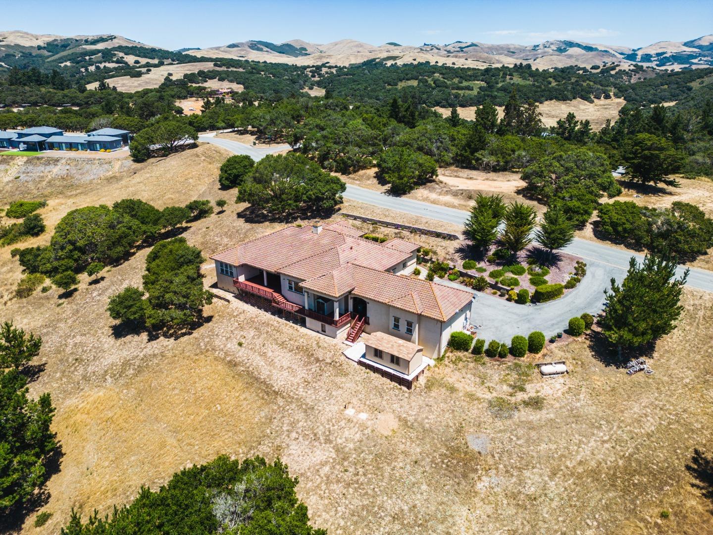 8944 Hidden Canyon Road Salinas, CA 93907 - Photo 21 of 22 an aerial view of a house with a yard and lake view