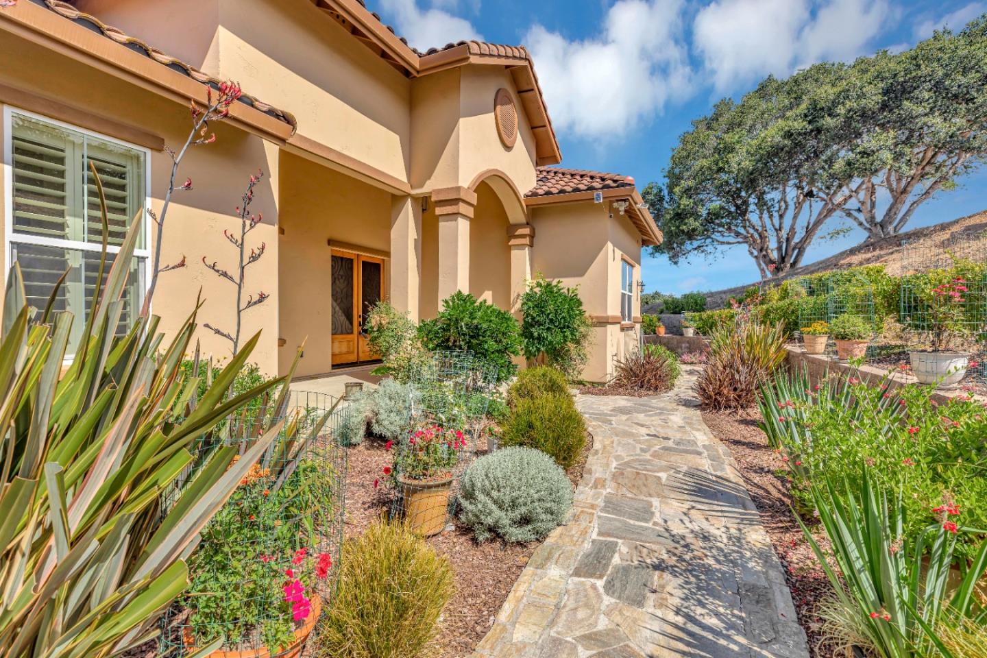 8944 Hidden Canyon Road Salinas, CA 93907 - Photo 6 of 22 a front view of a house with a yard