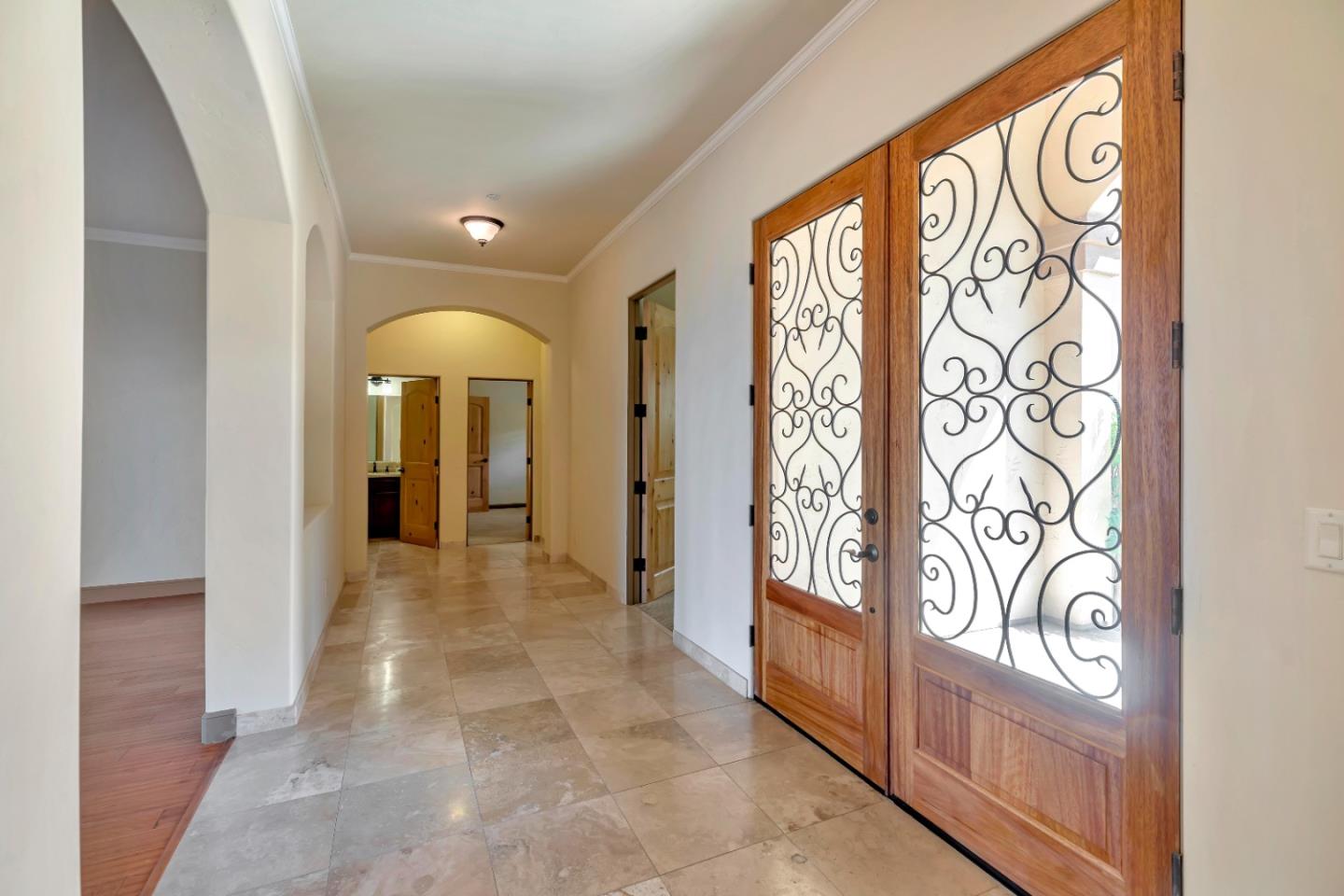 8944 Hidden Canyon Road Salinas, CA 93907 - Photo 9 of 22 a view of a entryway door with living room and furniture