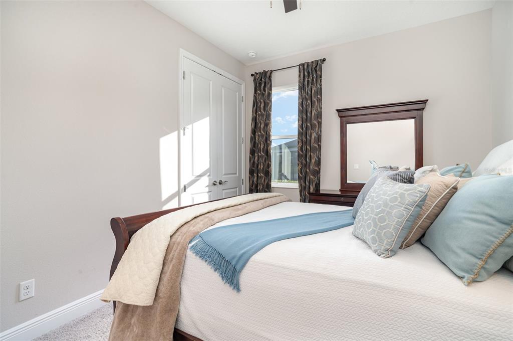 1904 146th Terrace East Parrish, FL 34219 - Photo 15 of 40 a bedroom with a bed and window