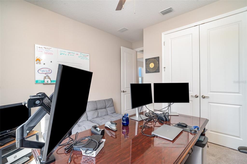 1904 146th Terrace East Parrish, FL 34219 - Photo 18 of 40 a view of a workspace with furniture