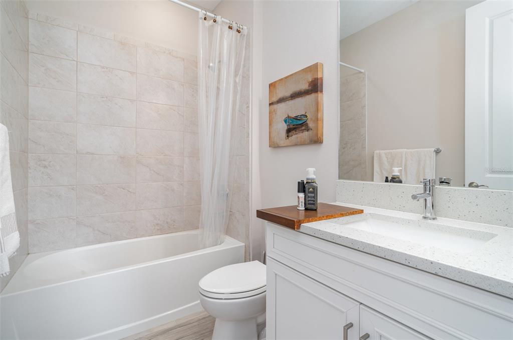 1904 146th Terrace East Parrish, FL 34219 - Photo 21 of 40 a bathroom with a sink a toilet and a bathtub