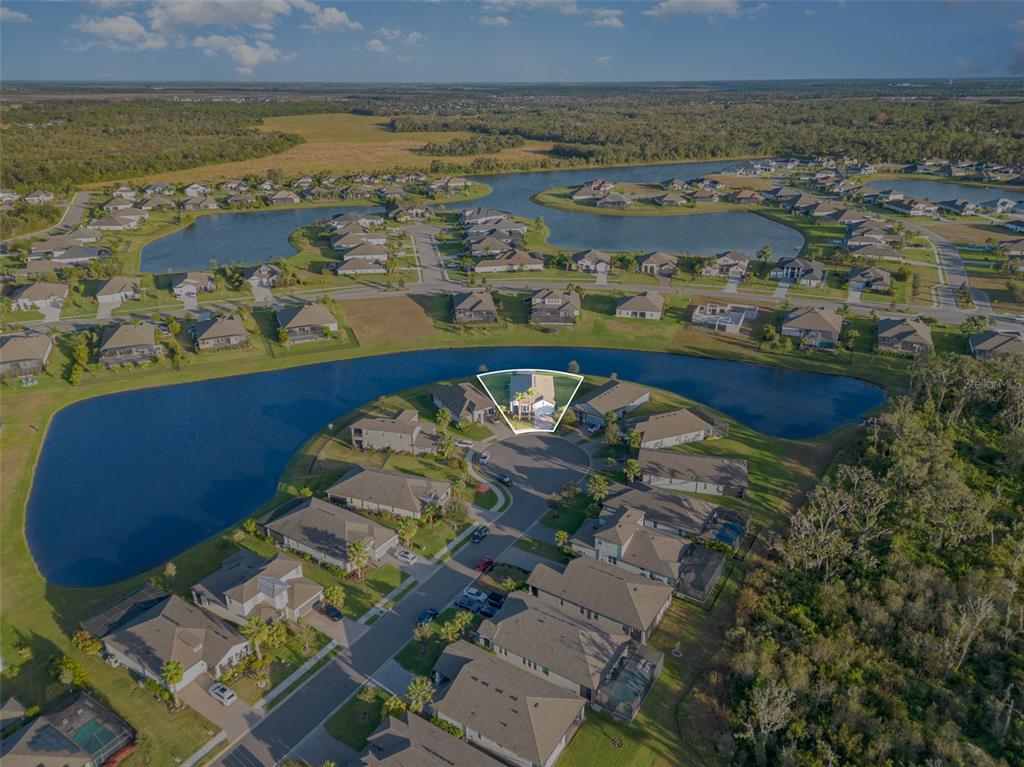 1904 146th Terrace East Parrish, FL 34219 - Photo 29 of 40 an aerial view of residential houses with outdoor space