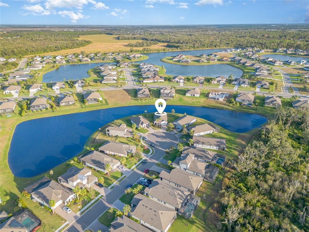 1904 146th Terrace East Parrish, FL 34219 - Photo 30 of 40 an aerial view of residential houses with outdoor space