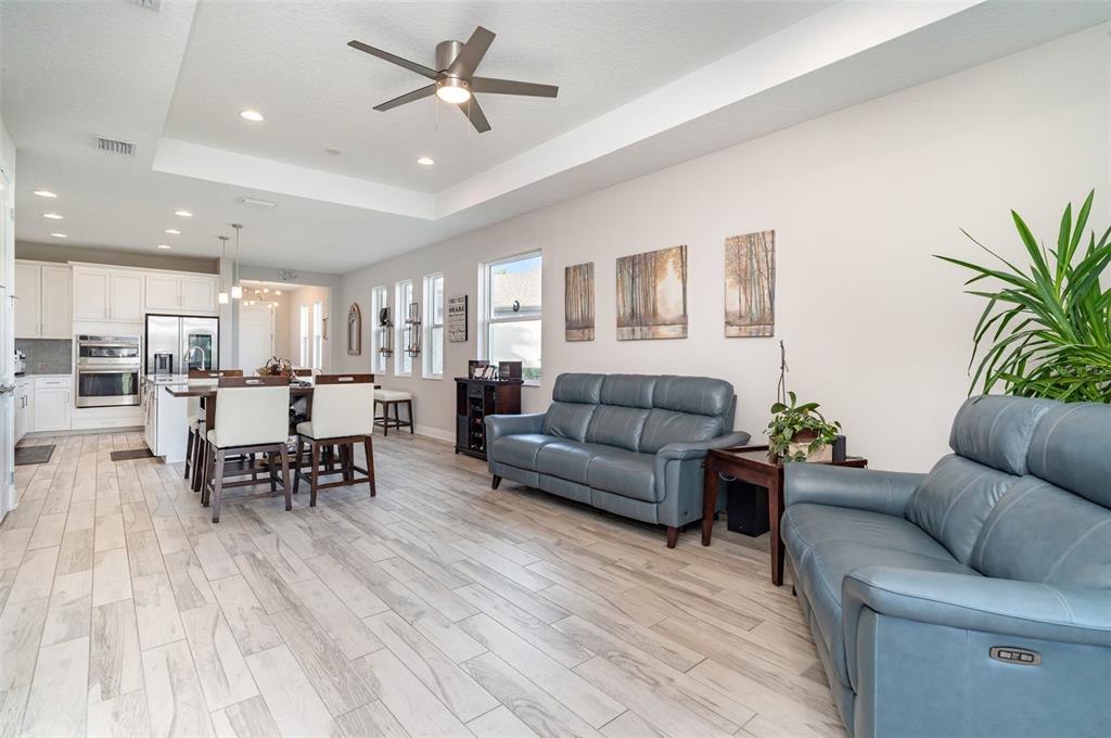 1904 146th Terrace East Parrish, FL 34219 - Photo 3 of 40 a living room with furniture and a view of kitchen