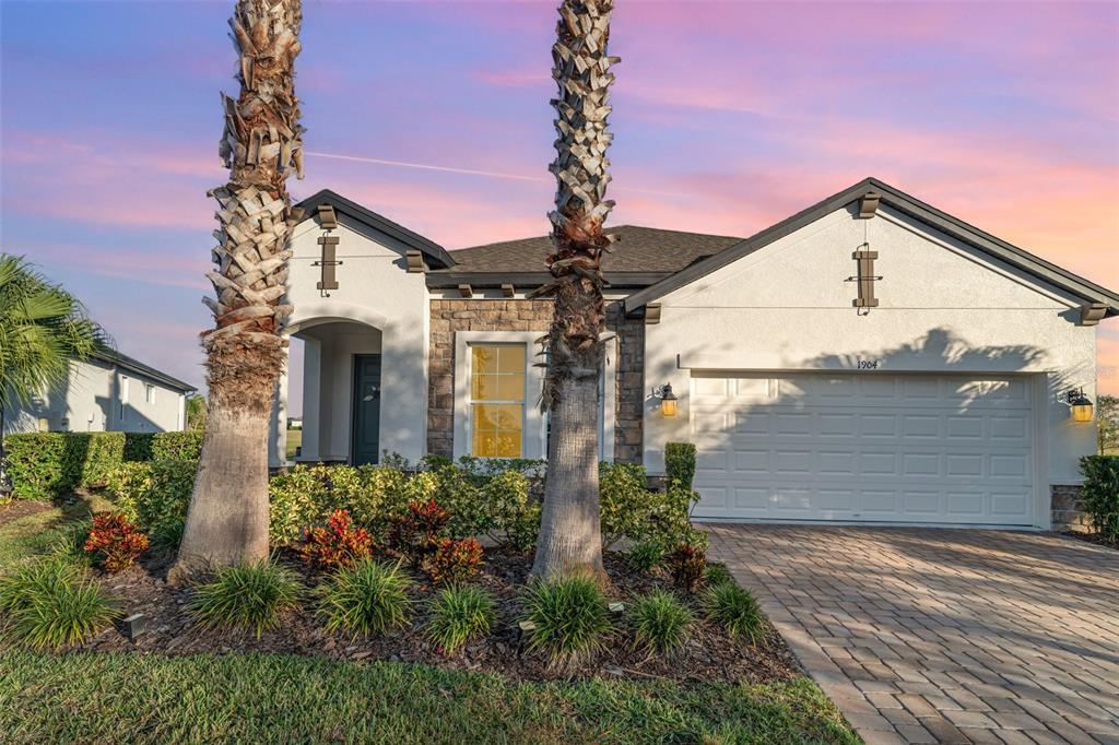 1904 146th Terrace East Parrish, FL 34219 - Photo 31 of 40 a front view of a house with garden