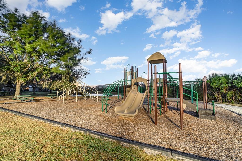 1904 146th Terrace East Parrish, FL 34219 - Photo 35 of 40 a view of a park with swings and slides