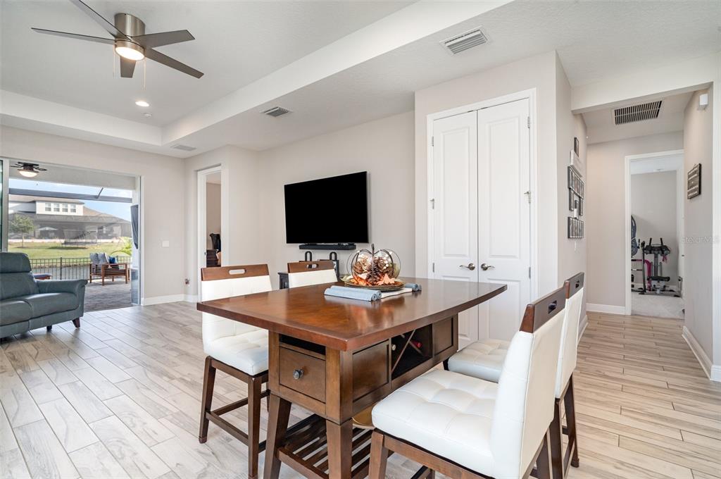 1904 146th Terrace East Parrish, FL 34219 - Photo 5 of 40 a view of a dining room with furniture window and wooden floor