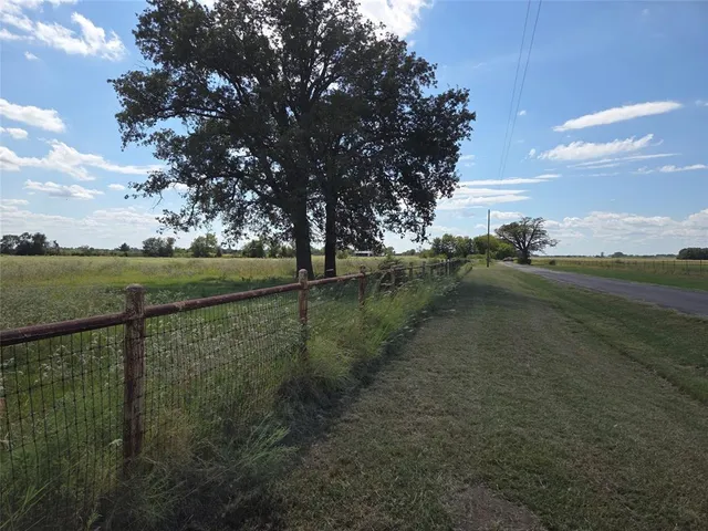 a view of a lake view with houses in back