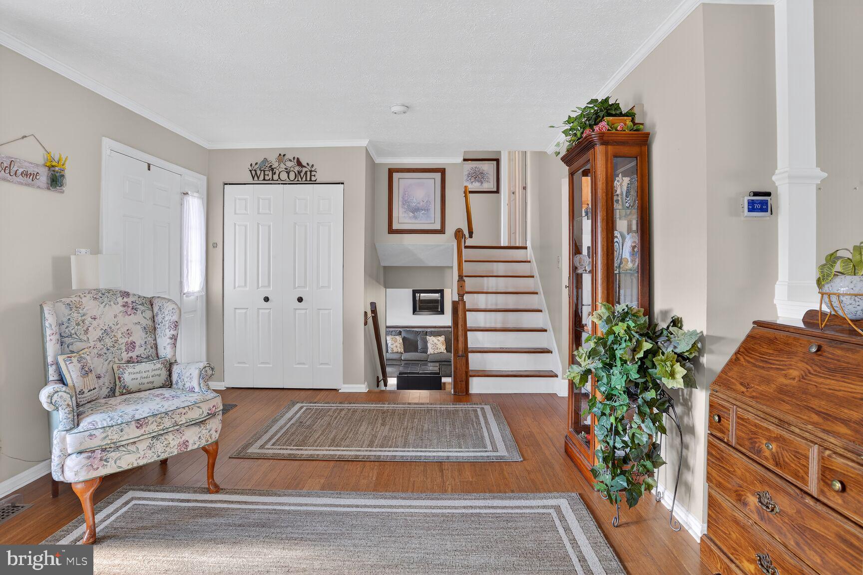 3726 Oakfalls Way Nottingham, MD 21236 - Photo 12 of 35 a living room with furniture and a potted plant