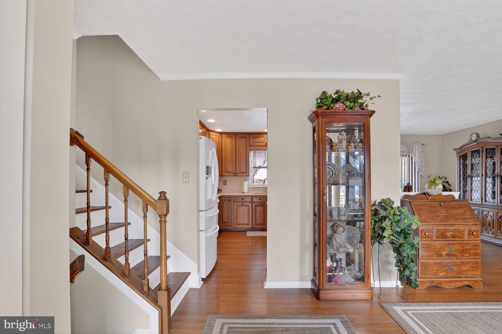 3726 Oakfalls Way Nottingham, MD 21236 - Photo 4 of 35 a view of an entryway with wooden floor and stairs