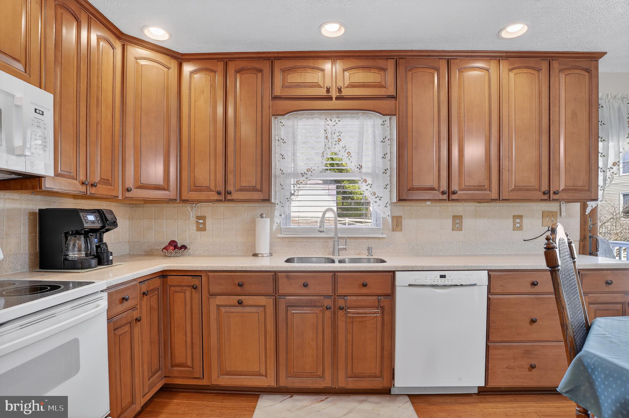 3726 Oakfalls Way Nottingham, MD 21236 - Photo 5 of 35 a kitchen with stainless steel appliances granite countertop a sink a stove cabinets and a window