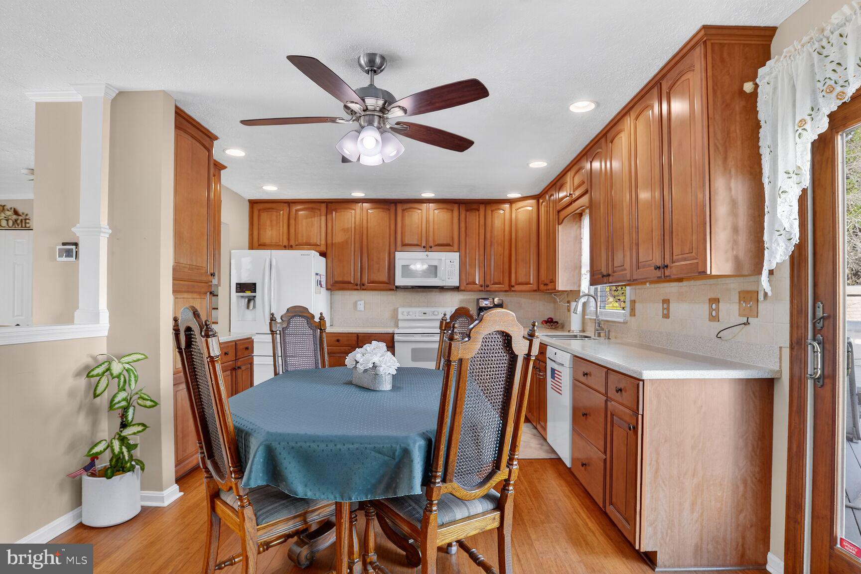 3726 Oakfalls Way Nottingham, MD 21236 - Photo 10 of 35 a view of a dining room with furniture window and wooden floor