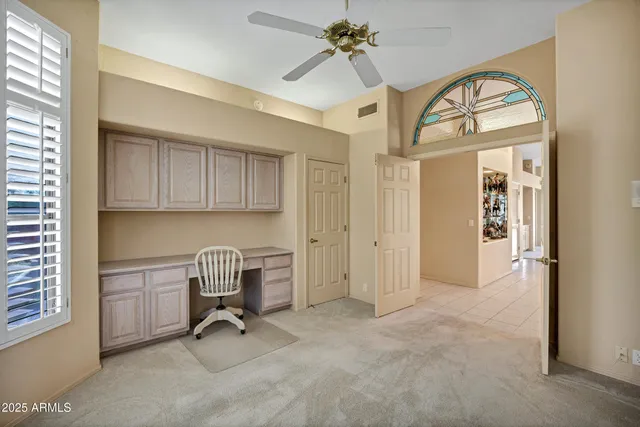 a view of a livingroom with furniture and a window