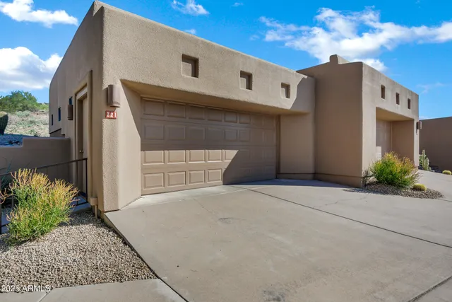 a front view of a house with stairs